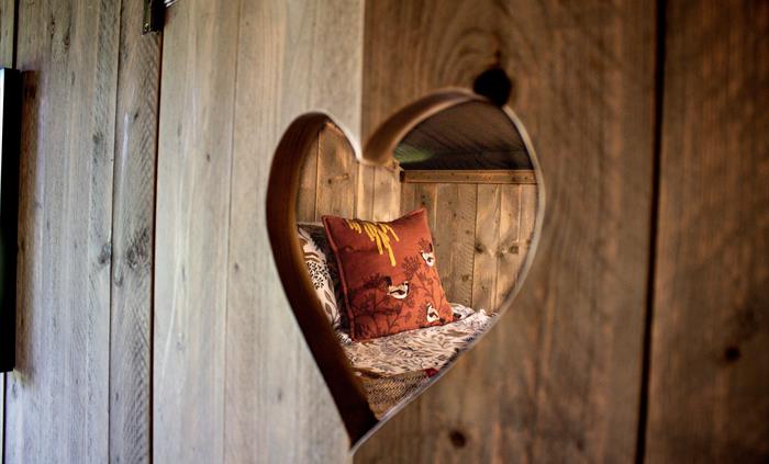 A double bed in a cosy cabin